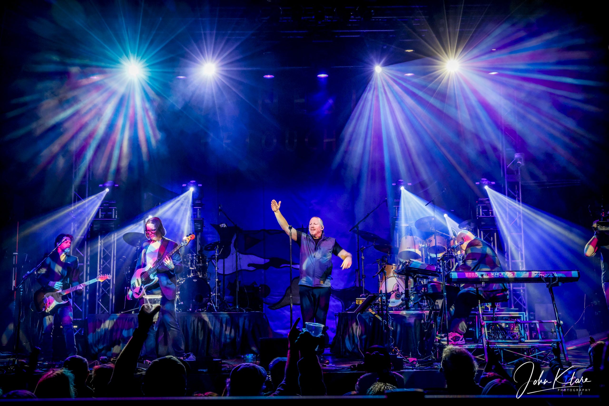 Genesis ReTouched performing live on stage